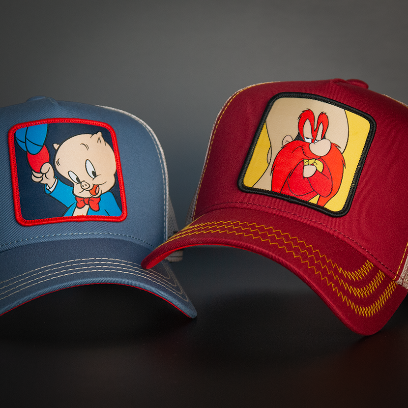 Dark Red OVERLORD X Looney Tunes smug Yosemite Sam trucker baseball cap hat with yellow zig zag stitching. PVC Overlord logo.