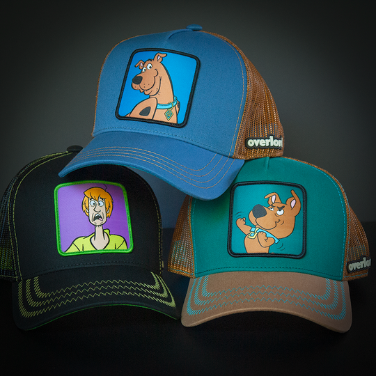 Blue OVERLORD X Scooby-Doo smiling Scooby trucker baseball cap hat with brown stitching. PVC Overlord logo.