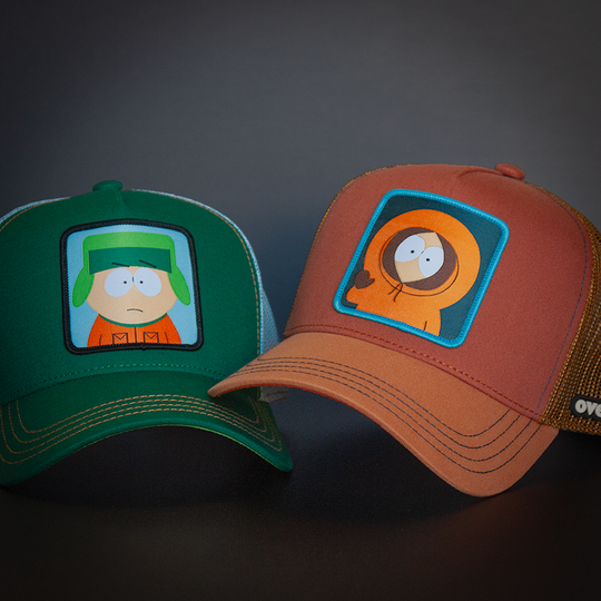 Green OVERLORD X South Park Kyle trucker baseball cap hat with orange stitching. PVC Overlord logo.