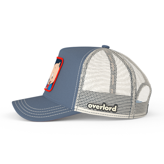 Blue OVERLORD X Looney Tunes Porky Pig holding a hat trucker baseball cap hat with cream mesh. PVC Overlord logo.