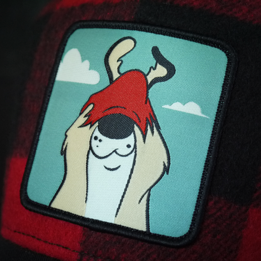 Buffalo Plaid OVERLORD X Looney Tunes Sam the Sheepdog trucker baseball cap hat woven Overlord patch closeup.