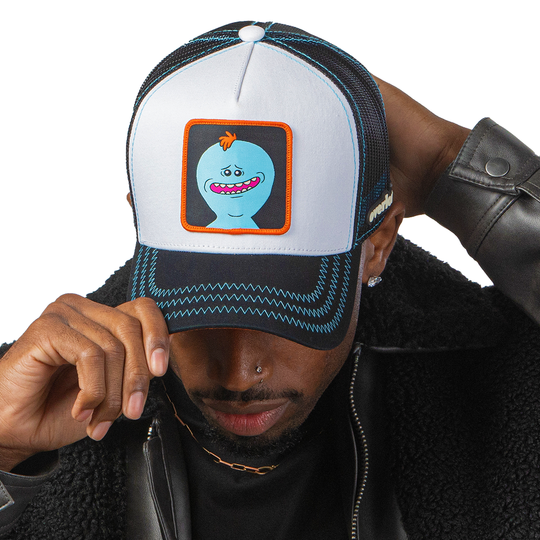 Man wearing white and black OVERLORD X Rick & Morty smiling Meeseeks trucker baseball cap hat with blue zig zag stitching. PVC Overlord logo.