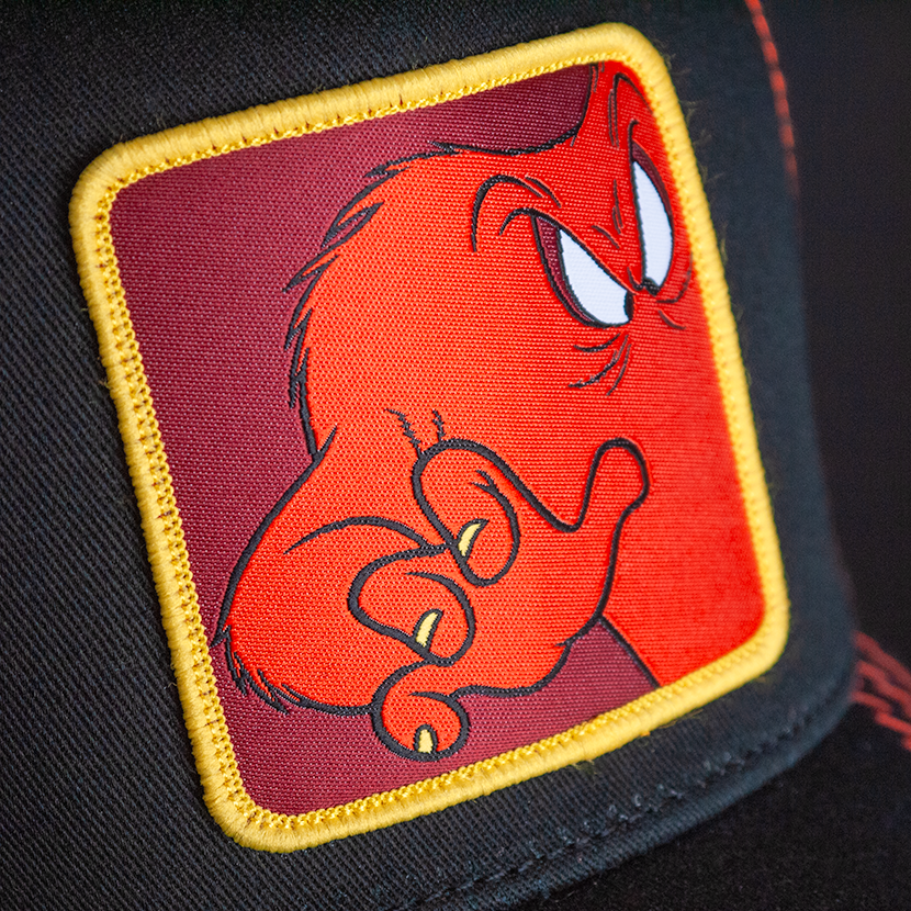 Black OVERLORD X Looney Tunes Gossamer trucker baseball cap hat woven Overlord patch closeup.