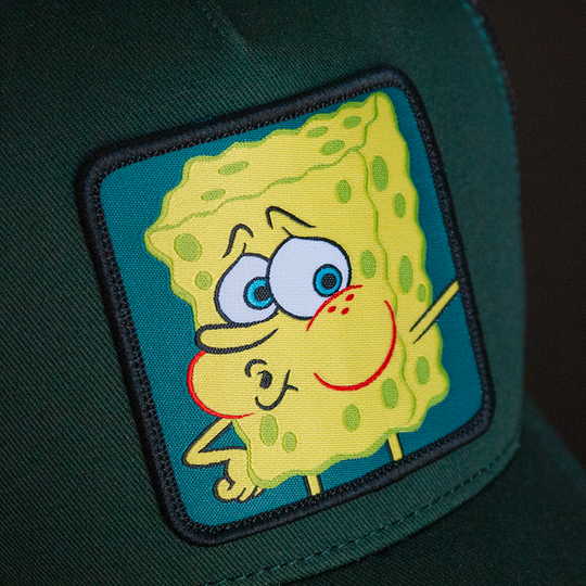 Dark green OVERLORD X SpongeBob exhausted meme trucker baseball cap hat woven Overlord patch closeup.