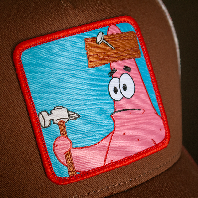 Brown OVERLORD X SpongeBob Patrick holding hammer trucker baseball cap hat woven Overlord patch closeup.