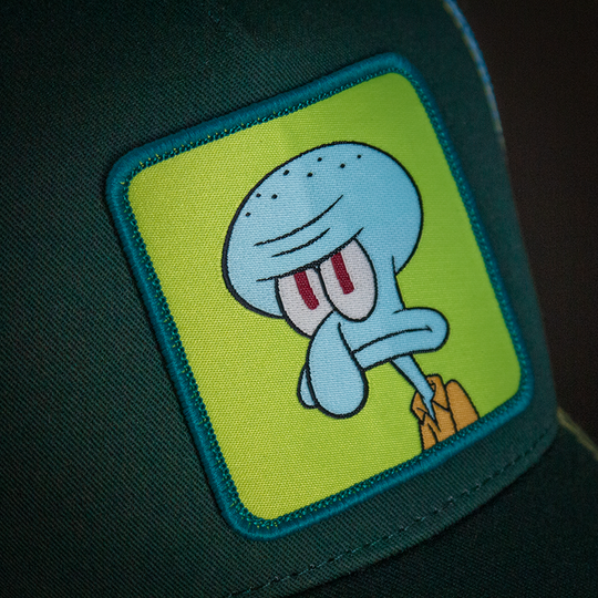 Dark green OVERLORD X SpongeBob serious Squidward trucker baseball cap hat with woven Overlord patch closeup.