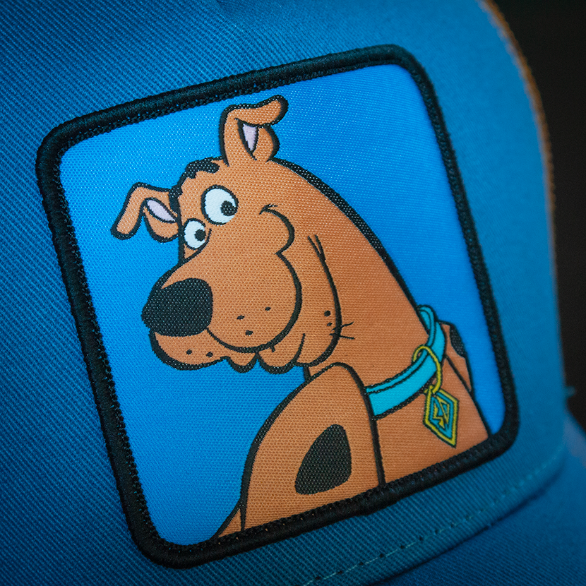 Blue OVERLORD X Scooby-Doo smiling Scooby trucker baseball cap hat woven Overlord patch closeup.