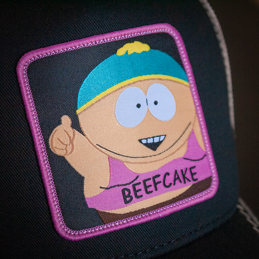 Black OVERLORD X South Park Cartman Beefcake trucker baseball cap hat woven Overlord patch closeup.