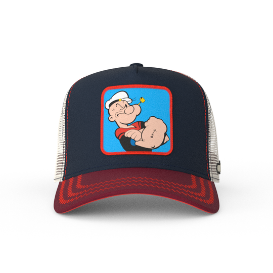 Navy and red OVERLORD X Popeye smug Popeye trucker baseball cap hat with red zig zag stitching. PVC Overlord logo.