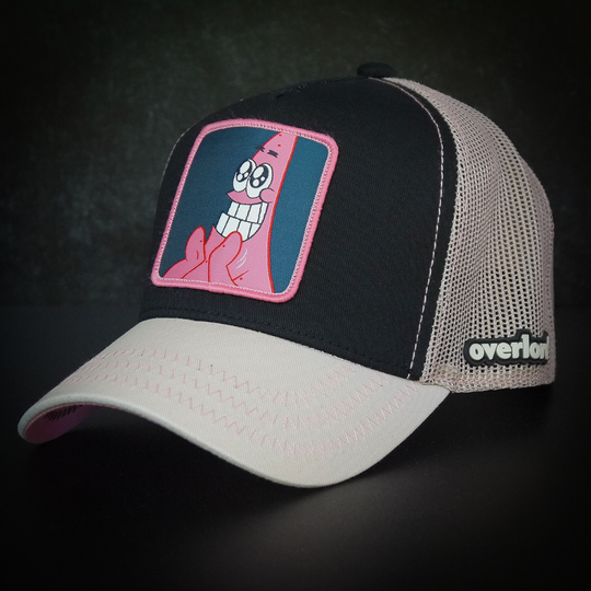 Black and tan OVERLORD X SpongeBob Big Smile Patrick trucker baseball cap hat with pink zig zag stitching. PVC Overlord logo.