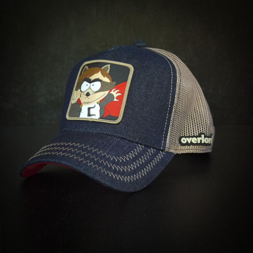 Dark blue denim OVERLORD X South Park Cartman Coon trucker baseball cap hat with khaki zig zag stitching. PVC Overlord logo.