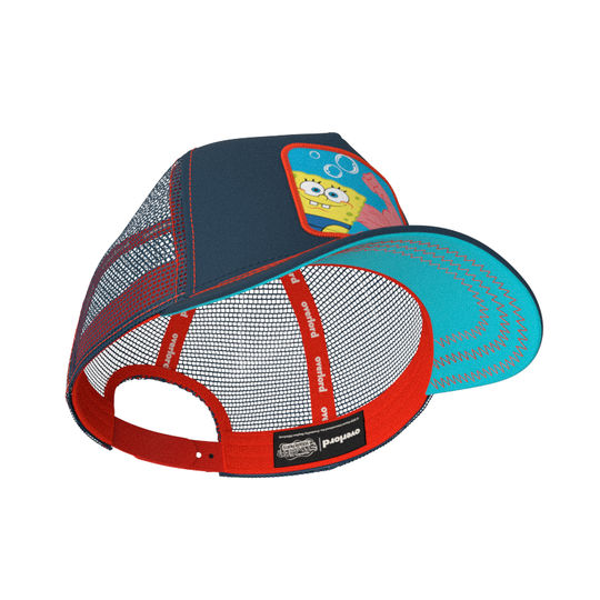 Navy OVERLORD X SpongeBob MuscleBob trucker baseball cap hat with red sweatband and turquoise under brim.