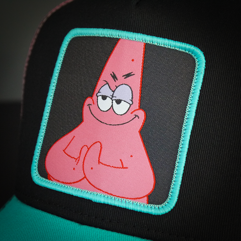 Black and turquise OVERLORD X SpongeBob sneaky Patrick trucker baseball cap hat woven Overlord patch closeup.