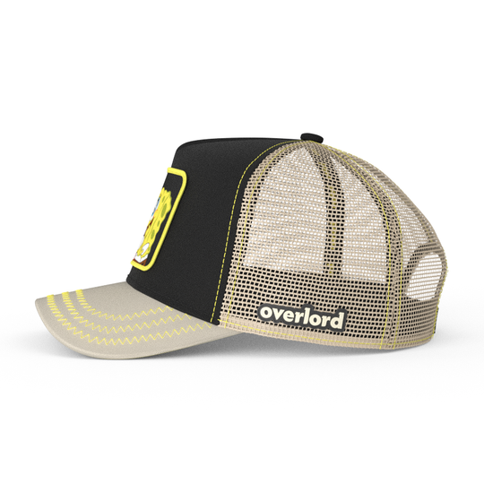 Black and tan OVERLORD X SpongeBob Big Smile SpongeBob trucker baseball cap hat with khaki mesh. PVC Overlord logo.