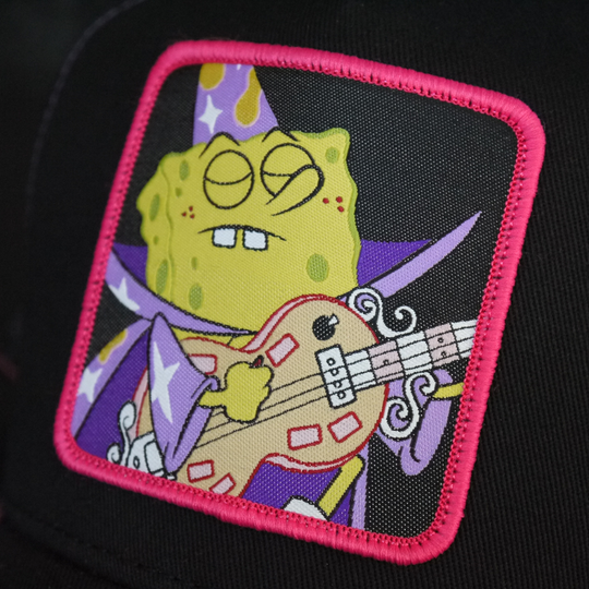 Black OVERLORD X SpongeBob Goofy Goober trucker baseball cap hat woven Overlord patch closeup.