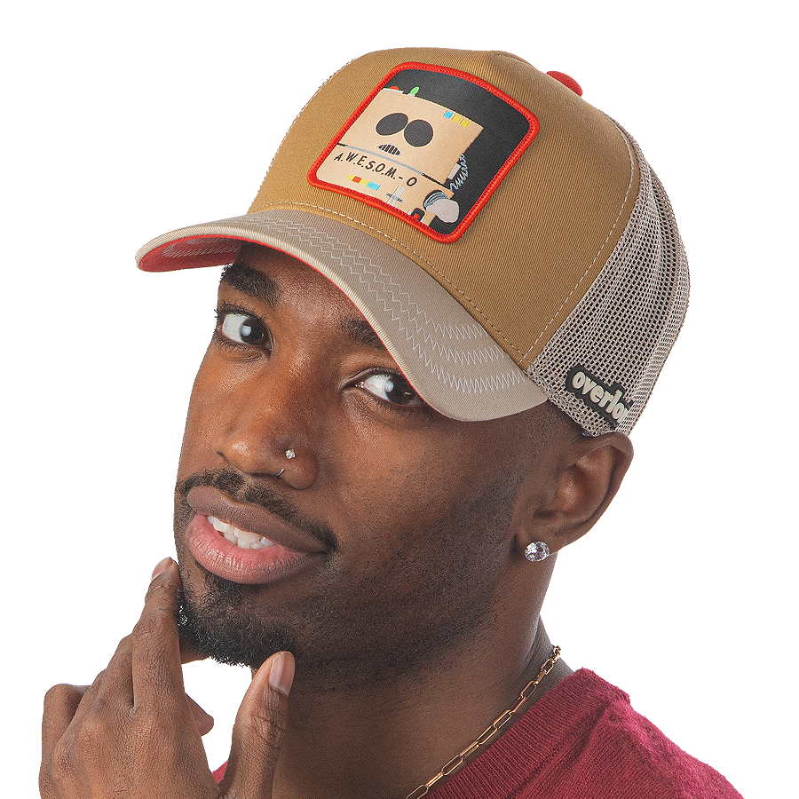 Man wearing tan and khaki OVERLORD X South Park A.W.E.S.O.M-O robot trucker baseball cap hat with khaki stitching. PVC Overlord logo.