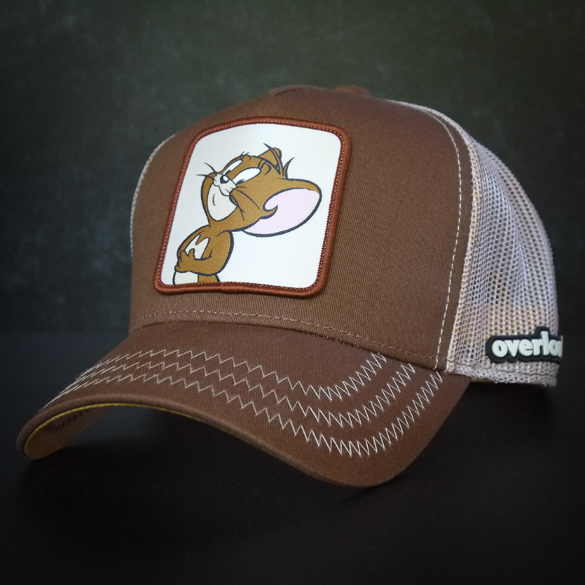 Brown OVERLORD X Tom and Jerry Jerry mouse trucker baseball cap hat with khaki zig zag stitching. PVC Overlord logo.